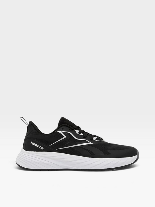 Tenis Reebok Classic para mujer en color negro con suela blanca, diseño deportivo y ligero de la tienda oklahoma