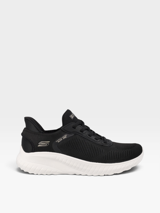 Tenis Skechers para mujer en color negro con tejido engineered knit, suela blanca y tecnología Memory Foam de oklahoma