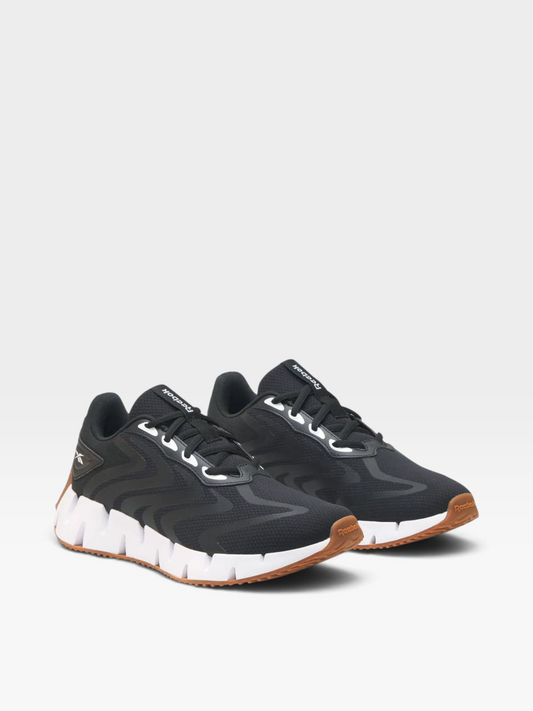 Tenis Reebok Lifestyle para mujer en color negro con suela blanca y detalles en goma, disponibles en oklahoma