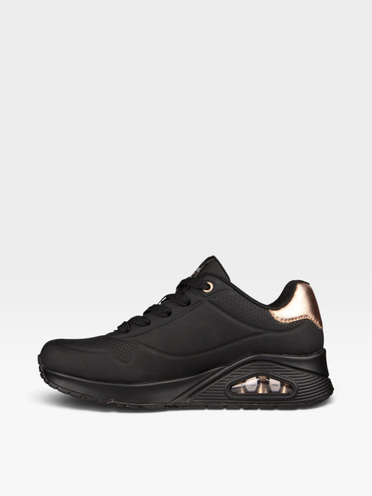 Tenis Skechers D'Lites negros para mujer con detalles en tono cobre y suela chunky, disponibles en oklahoma.