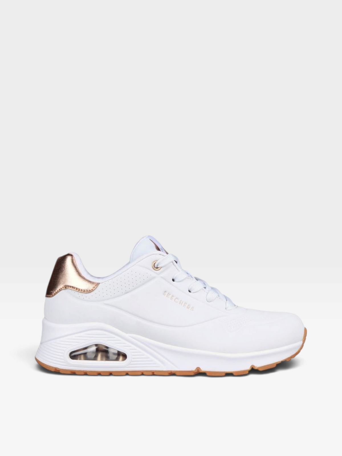 Tenis Skechers para mujer en color blanco con detalle metalizado en el talón y suela con cámara de aire de oklahoma
