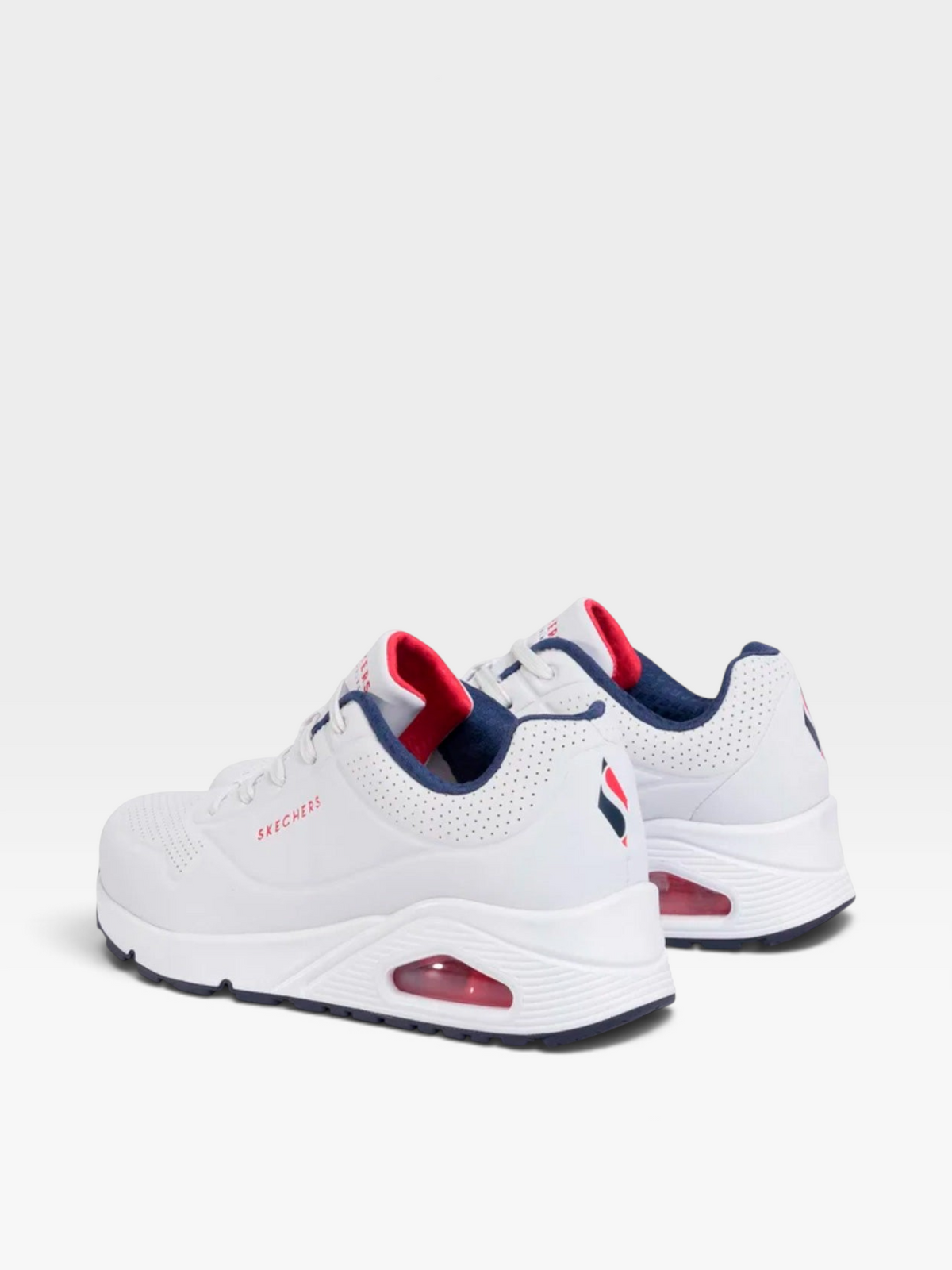 Tenis Skechers Uno oklahoma blancos con detalles en azul y rojo, suela con cámara de aire y cuero sintético perforado