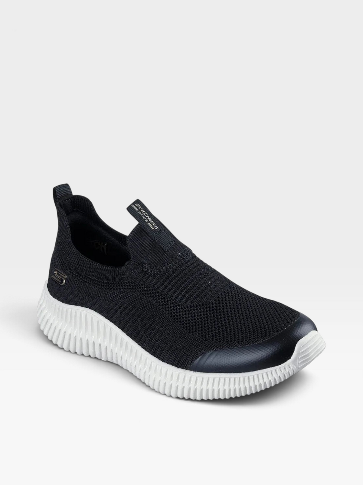 Tenis Skechers para mujer en color negro con diseño slip-on, suela blanca flexible y plantilla Memory Foam oklahoma