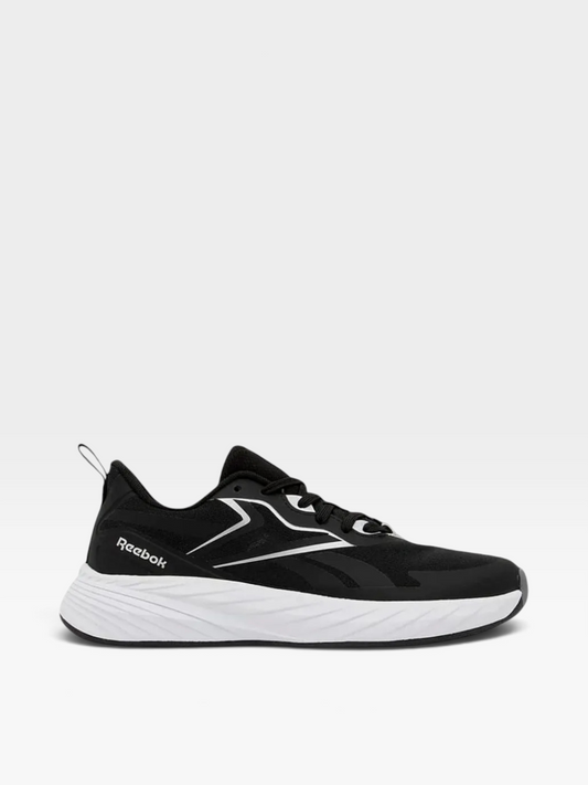 Tenis Reebok Classic para mujer en color negro con suela blanca, diseño deportivo y ligero de la tienda oklahoma