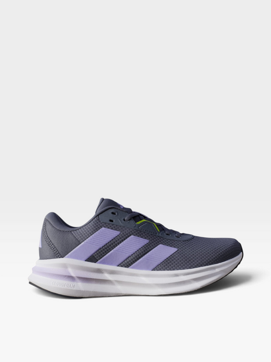 Tenis de running oklahoma Adidas Galaxy 7 para mujer en gris con franjas lilas, malla transpirable y suela Cloudfoam