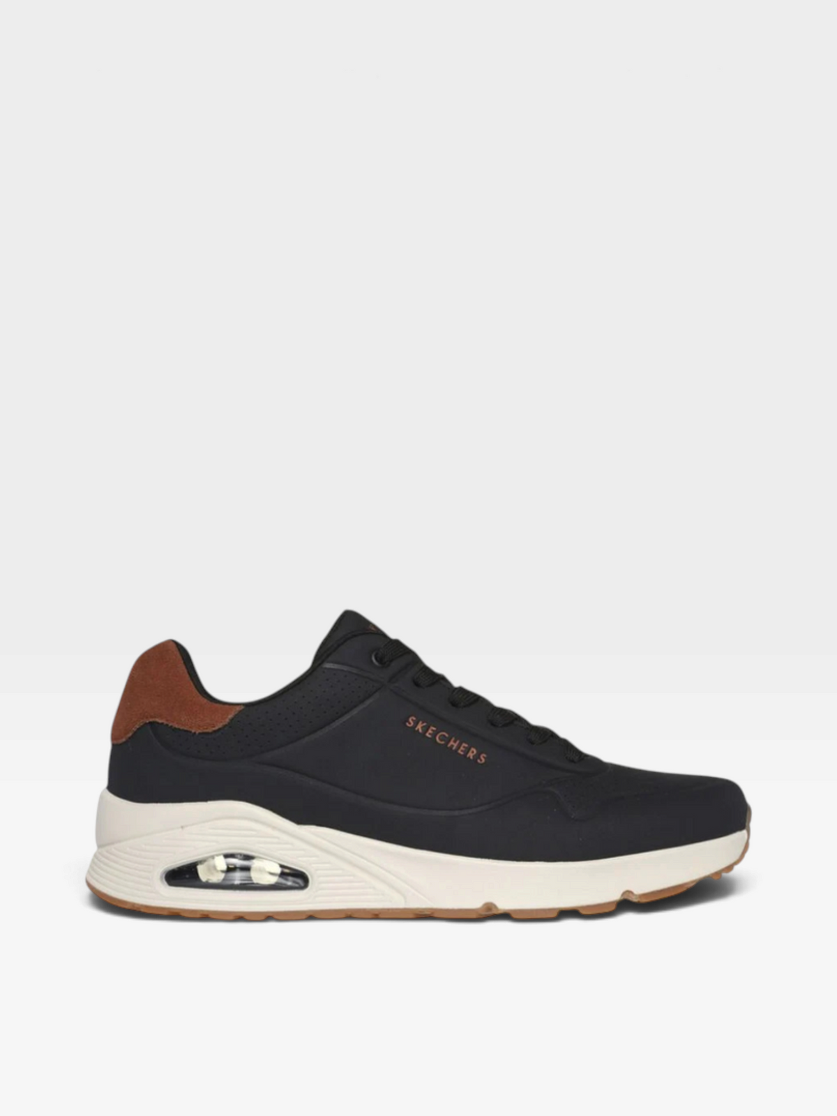 Tenis oklahoma Skechers Uno-Suited negros con detalle en talón marrón y suela blanca con cámara de aire visible