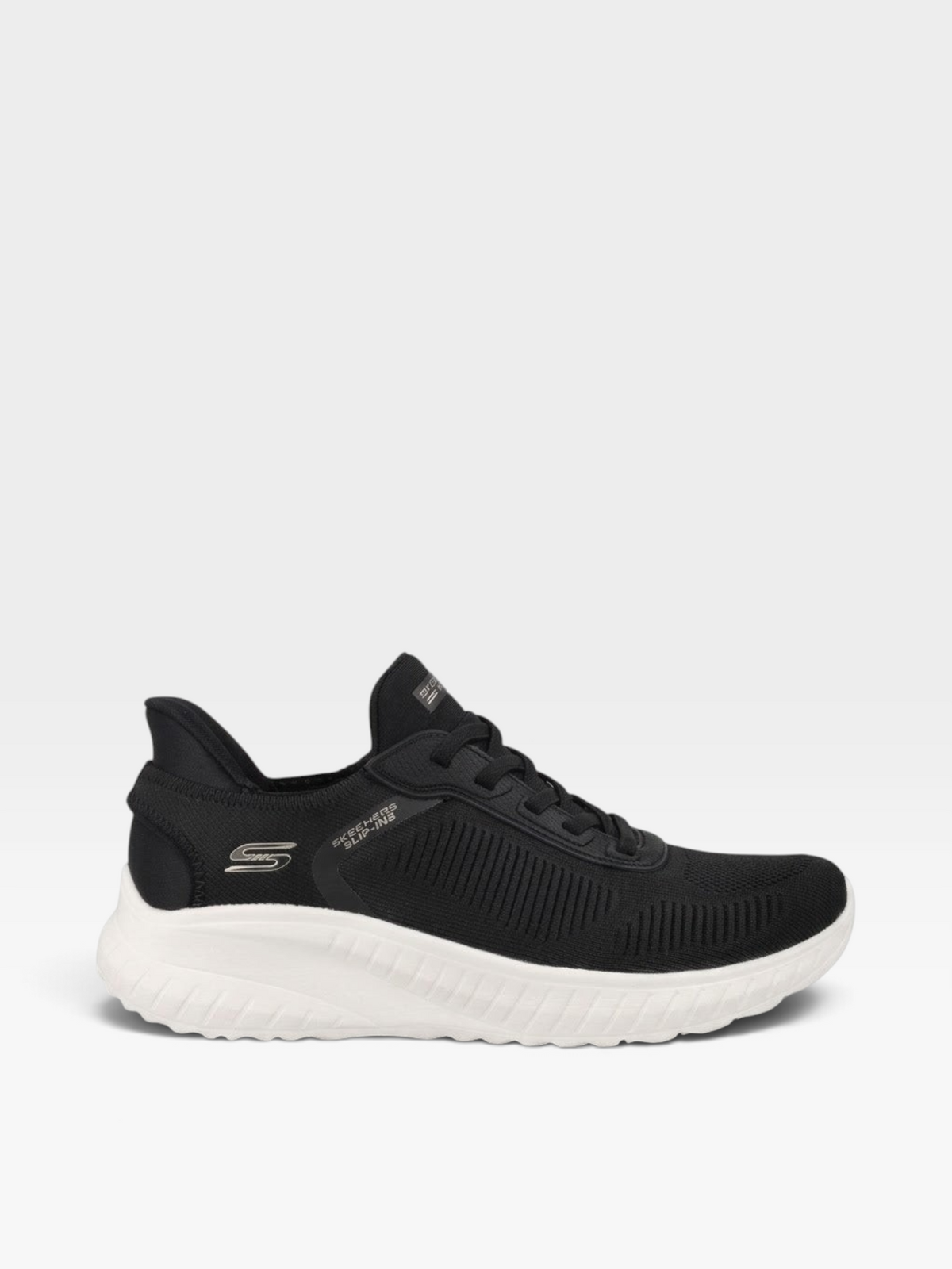 Tenis Skechers para mujer en tejido knit negro con suela blanca, disponibles en oklahoma